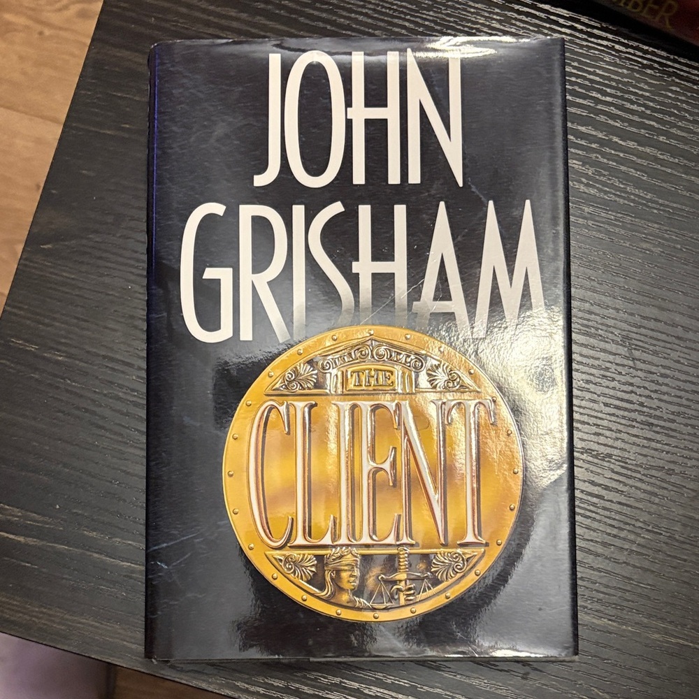 'The Client' Hardcover Book - Black and Gold